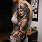 A woman with a sleeve tattoo of the Hindu goddess Sa ccfa c b eb beea 271123 tatufoto.com