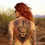 A woman with a stunning tattoo of a lion across her back, captured while on a safari adventure 4 - 07,11,2023 tatufoto.com