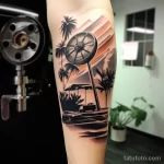 Close-up of a tattoo depicting a classic film reel and clapperboard on a forearm 1_3 16.11.2023 tatufoto.com 14