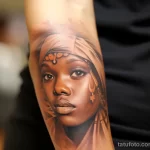 Close-up on a girl's arm with a blurry and faded old tattoo highlighting the change in skin color and texture 3 09112023 tatufoto.com 075