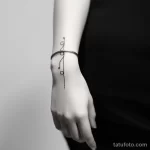 . Minimalist musical notes on wrist. tattoo v 16.11.2023 tatufoto.com 027