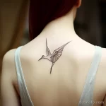 . Origami crane in flight on shoulder blade 16.11.2023 tatufoto.com 033