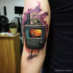 Tattoo of a TV with a reality show scene on the scre fbab fac d aa feaa 181123 tatufoto.com