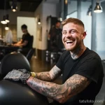 Tattooed man smiling while getting a new arm tattoo befbe d cfc da bad _1_2_3 231123 tatufoto.com