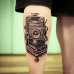 tattoo . Vintage camera tattoo on calf. v 16.11.2023 tatufoto.com 253