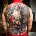 уник тату фото Large detailed tattoo of Santa Claus on the back, depicting him in full height with a bag of gifts 2_3 13.11.2023 tatufoto.com 18