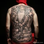 уник тату фото Large detailed tattoo of Santa Claus on the back, depicting him in full height with a bag of gifts 2_4 13.11.2023 tatufoto.com 19