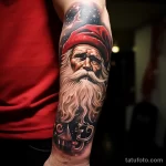 уник тату фото Realistic style Santa Claus tattoo on the forearm, focusing on the details of his face and beard 1_4 13.11.2023 tatufoto.com 34