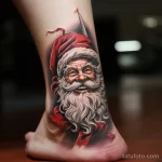 уник тату фото Santa Claus tattoo on the ankle, depicting him in a characteristic pose with his finger raised up 6_2 13.11.2023 tatufoto.com 37
