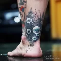 A close up of a mans ankle tattoo with bubbles aroun cca dcc b ab ce 171223 tatufoto.com 003