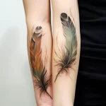 Realistic tattoo of a pair of matching feathers s cabb b ab f abec _1_2_3 031223 tatufoto.com