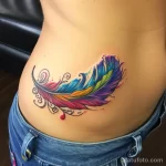 Интимное тату на фото - Colorful feather tattoo on the lower belly style cc a c fcb _1 - 080224 tatufoto.com 105