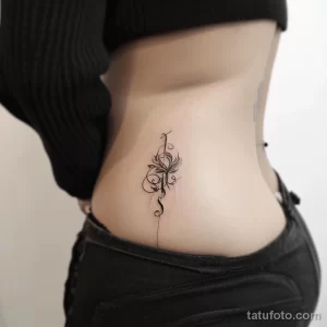 Интимное тату на фото - Elegant script tattoo along the pelvic bone style b cd c dcbf _1 - 080224 tatufoto.com 208