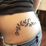 Интимное тату на фото - Elegant vine tattoo winding along the side hip st aff e f bdbbe - 080224 tatufoto.com 215