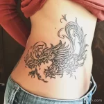 Интимное тату на фото - Phoenix tattoo rising from the pelvic area style de da a ebccd - 080224 tatufoto.com 336