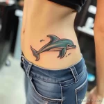 Интимное тату на фото - Playful dolphin tattoo on the side waist style ra bfea c b fd - 080224 tatufoto.com 337