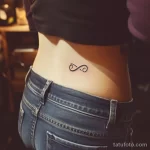 Интимное тату на фото - Small infinity symbol tattoo on the lower back st bbba ecc cb ea fbc - 080224 tatufoto.com 397
