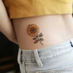 Интимное тату на фото - Small sunflower tattoo on the lower back style ra bcd acd b bf afecdd _1_2 - 080224 tatufoto.com 427