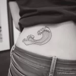Интимное тату на фото - Small wave tattoo on the lower back style raw s abdfb dcc e c bbbf - 080224 tatufoto.com 429