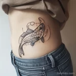 Интимное тату на фото - Stylized fish tattoo on the side waist style raw ae d de aba - 080224 tatufoto.com 462