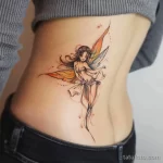 Интимное тату на фото - Whimsical fairy tattoo on the lower back style ra bbe ff d aec eadb _1_2 - 080224 tatufoto.com 561