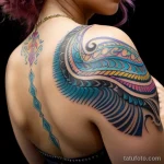 00002-Young woman with colorful back tattoo, looking over shoulder, confused look 2606053935 tatufoto.com 005 tatufoto.com 005