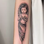 00036-enhance_angel_baby_tattoo_in_realistic_style,_using_subtle_shading,_fine_lines,_and_natural_textures_for_depth_984689371