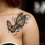 00061-Woman with butterfly tattoo on chest, thoughtful in a coffee shop 1464492572 tatufoto.com 053 tatufoto.com 053