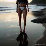 00155-Elegant woman with thigh tattoo, standing on the beach, reflective 1464492669 tatufoto.com 115 tatufoto.com 115
