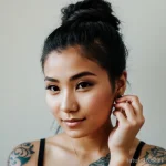 beautiful young woman with a minimalist tattoo on her finger tatufoto.com 038