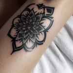 black and white heart tattoo on a woman’s wrist, detailed shot, tatufoto.com 303