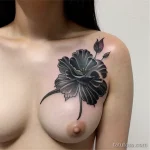 black carnation tattoo on the chest tatufoto.com 021