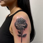 close-up of a black carnation tattoo on a woman s tatufoto.com 234