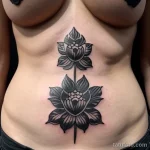 close-up of a black carnation tattoo on a woman s tatufoto.com 236