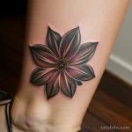 close-up of a woman’s ankle tattoo, representing her younger days tatufoto.com 160