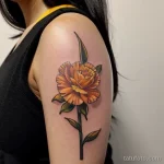 close-up of a yellow carnation tattoo on a woman s LU078O71 tatufoto.com 267