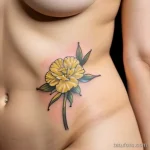 close-up of a yellow carnation tattoo on a woman s LVDT5KD0 tatufoto.com 277