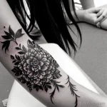 detailed black and white tattoo on a woman’s wrist, close-up, tatufoto.com 284
