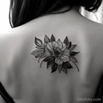floral design tattoo on a woman’s back, black and white, close-up, tatufoto.com 330