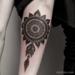 intricate tattoo on a woman’s forearm, black ink, high detail, tatufoto.com 287