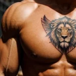 muscular man with a hammer tattoo on his chest, symbolizing hard work, standing in a construction site tattoo lion, on neck sexy tatufoto.com 202