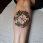 tattoo of a nature wreath on a woman s thigh tatufoto.com 234
