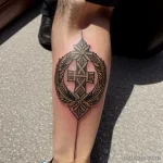 tattoo of a victory wreath on a man s calf tatufoto.com 250