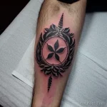 tattoo of a wreath with flames on a man s forearm tatufoto.com 265
