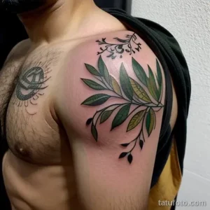 tattoo of a wreath with olive branches on a man s shoulder tatufoto.com 270