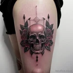 tattoo of a wreath with skulls and roses on a woman s thigh tatufoto.com 282