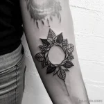 tattoo of a wreath with thorns on a woman s forearm tatufoto.com 295