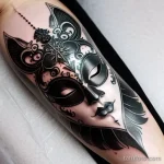 venetian mask tattoo in black ink with silver accents tatufoto.com 139