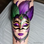 vibrant venetian mask tattoo with feathers tatufoto.com 267