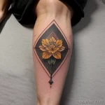 yellow carnation tattoo on the calf tatufoto.com 357
